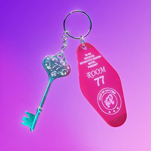 Pink hotel key tag with silver key, reading "Room 77" and "Ta-ra".