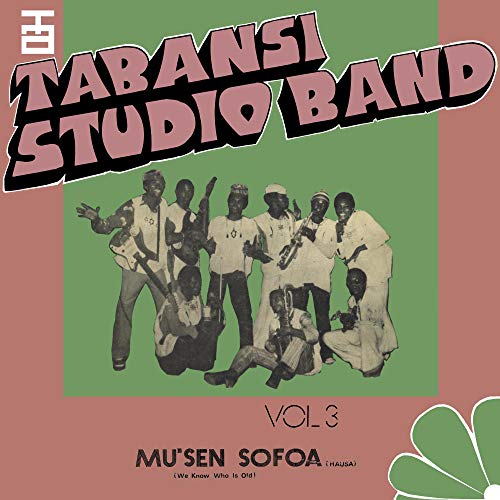 "Album cover with musicians, pink, green, and white colors, and bold text."