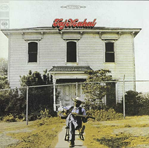 Taj Mahal album cover: a house, a musician with a guitar.