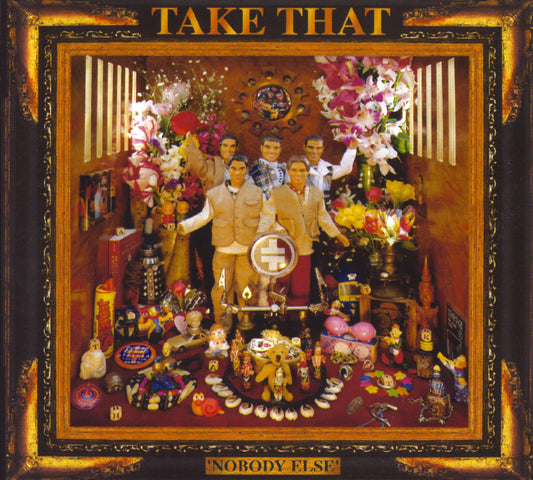 Take That’s “Nobody Else” album cover with the band surrounded by objects.