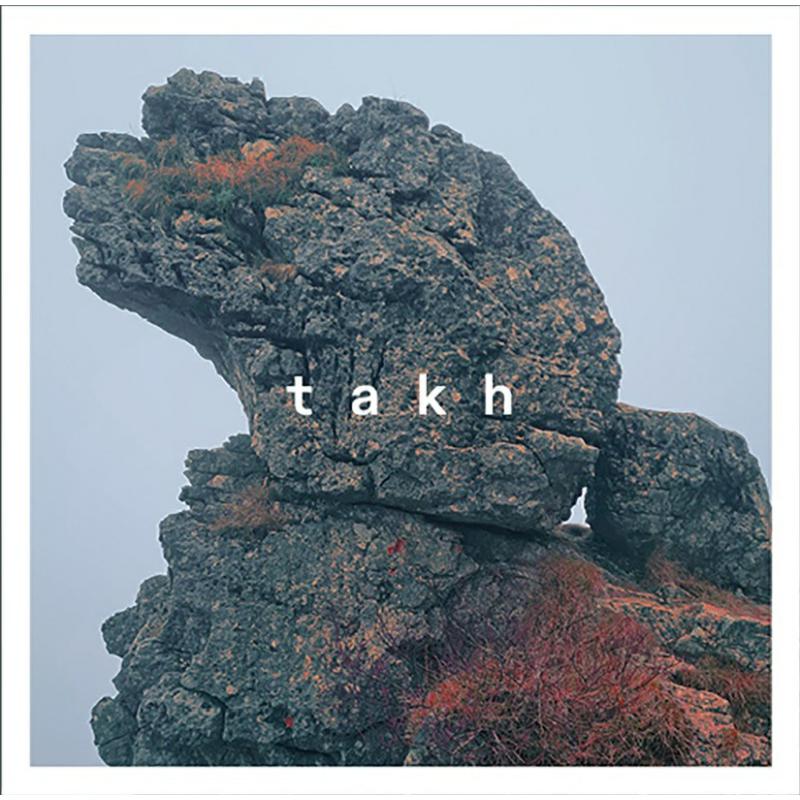CD cover with a large, textured rock formation and the word "takh".