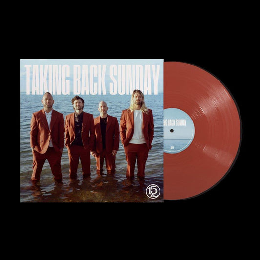 Four men in red suits standing in shallow water, vinyl record partially visible.