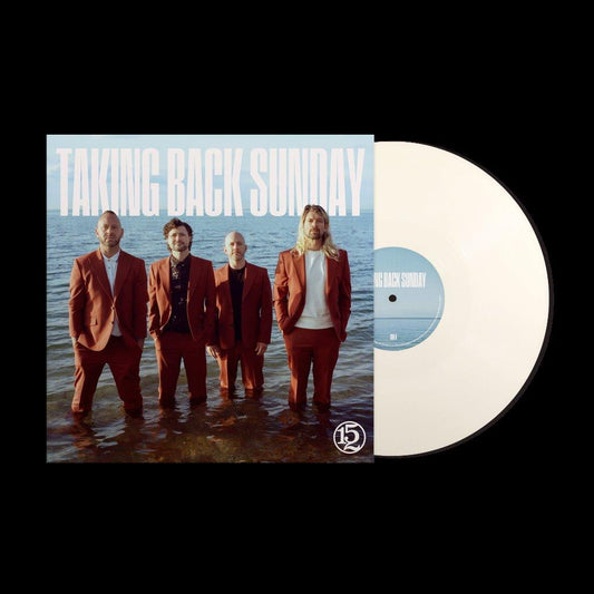 Four men in suits standing in shallow water, vinyl record partially visible.