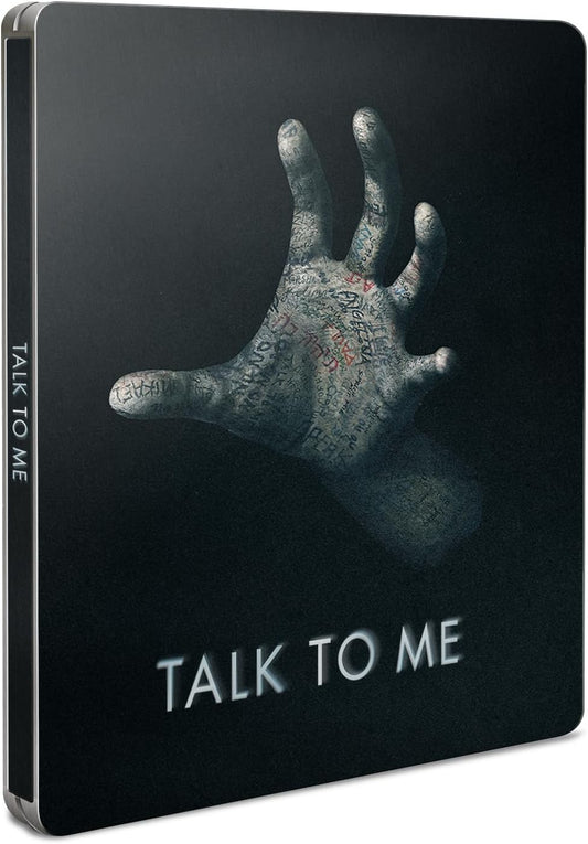“Talk to Me” Steelbook cover with a hand and writing imagery.