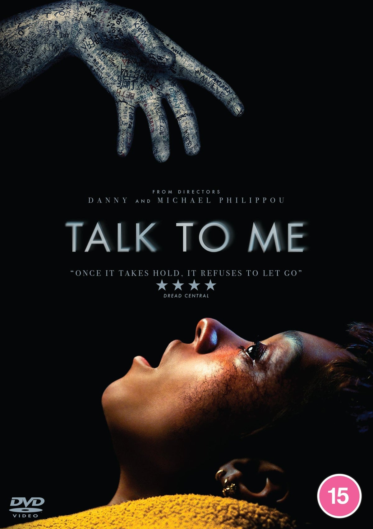 DVD cover art showing a hand covered in writing reaching toward a person's face.