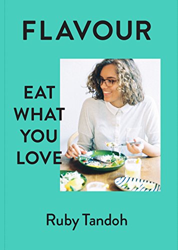 Cookbook cover featuring a woman with a plate of food.