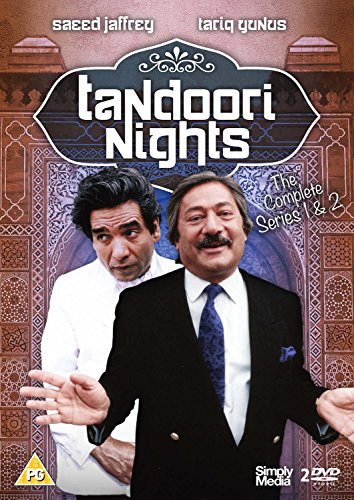 Two men in formal wear on DVD cover with ornate background and text.
