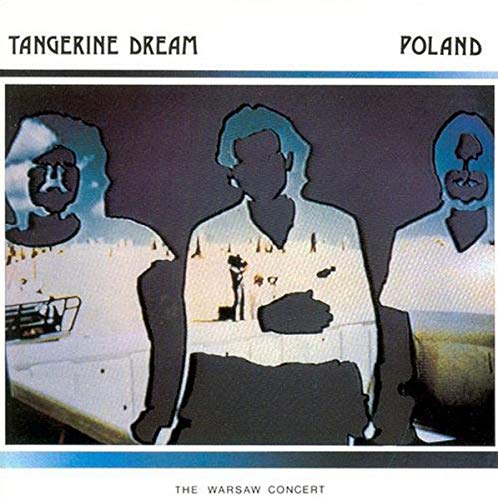 Tangerine Dream album cover: three silhouetted faces over a city scene.