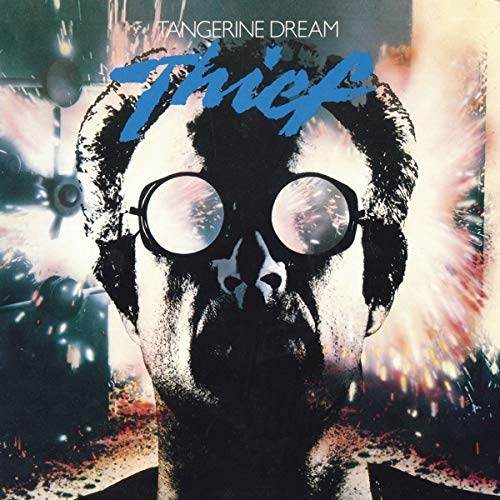 Album cover featuring a person wearing goggles against a background of bright explosions.