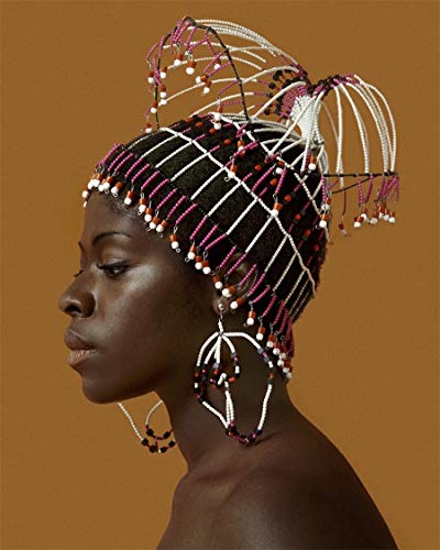 Black woman in profile wearing an elaborate beaded headpiece and earrings.