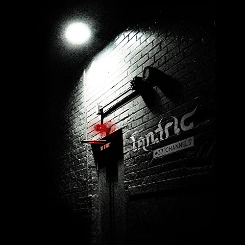 Black and white brick wall with a glowing red light and Tantric 37 Channels text.