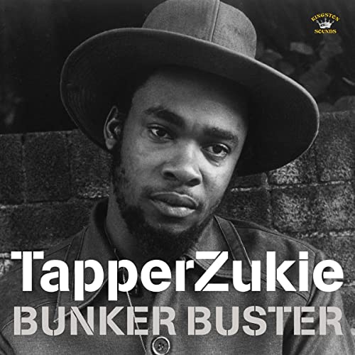 Black and white portrait of Tapper Zukie wearing a fedora, album cover.