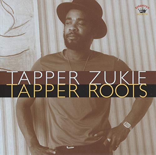 Tapper Zukie portrait on album cover, wearing a hat and neutral shirt.
