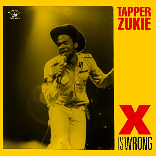 "Album cover with man in hat holding microphone, yellow background, red and black text."