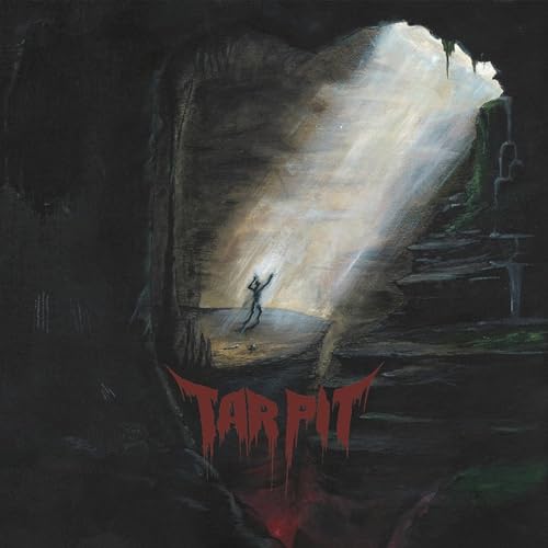 A dark cave with a light beam illuminating a figure and red text below.
