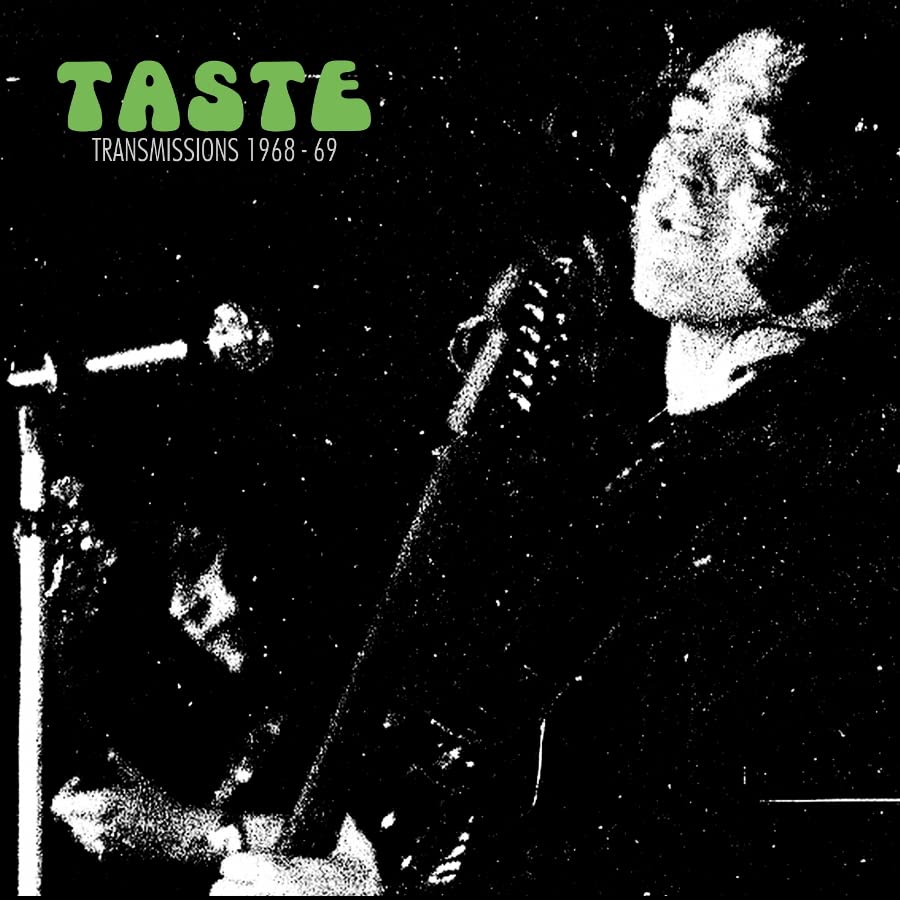 Black and white concert photo of a singer with a microphone.