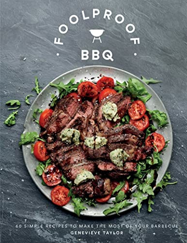 Cookbook cover with grilled meat and tomatoes on a plate.