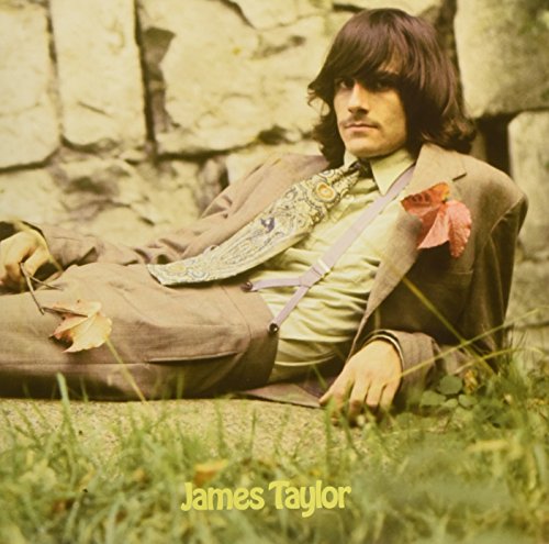 James Taylor album cover featuring the artist leaning against a stone wall.