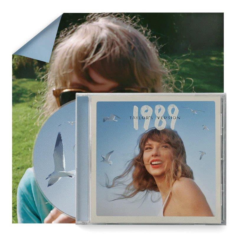 Taylor Swift’s “1989 (Taylor’s Version)” CD case with a blue sky background.