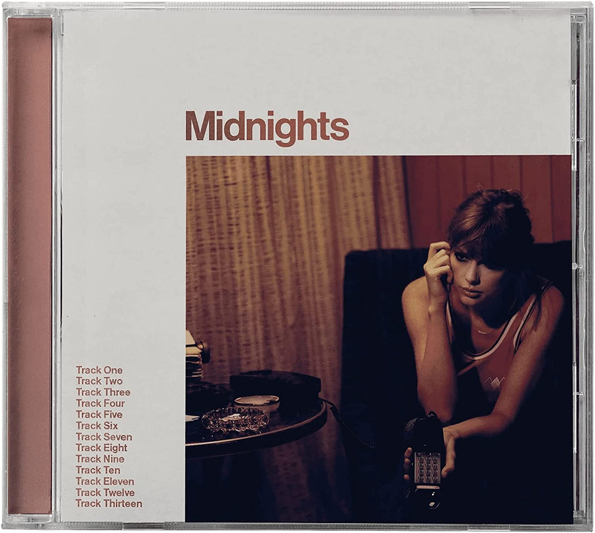 Taylor Swift's "Midnights" CD case with a portrait of the artist.