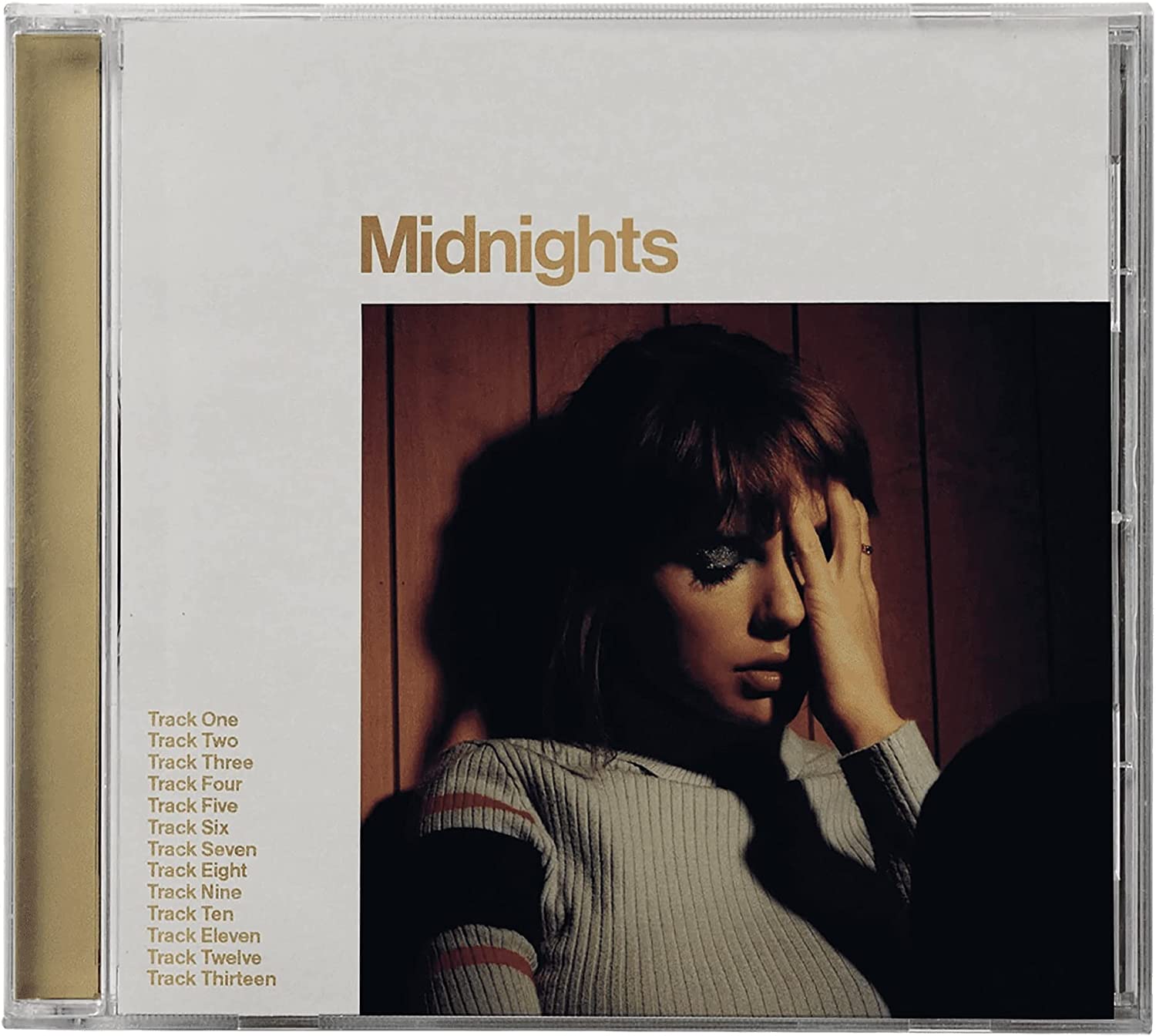 Taylor Swift’s “Midnights” CD cover with a portrait of the artist.