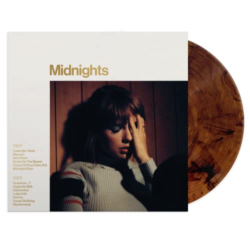 Taylor Swift Midnights vinyl record cover and a marbled brown vinyl disc.