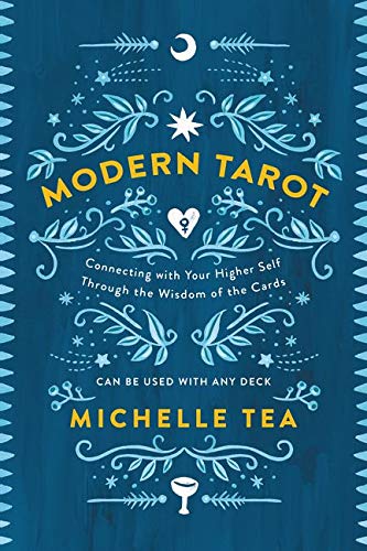 Blue tarot book cover with ornate gold and white lettering and celestial designs.