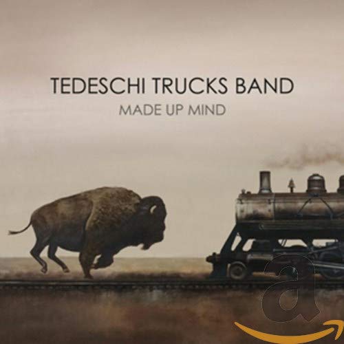 Tedeschi Trucks Band album cover: bison running alongside a steam train.