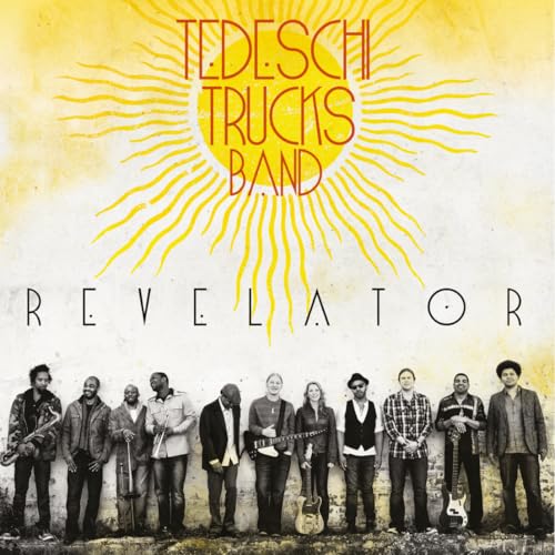 Tedeschi Trucks Band Revelator album cover featuring the band members standing against a yellow background.