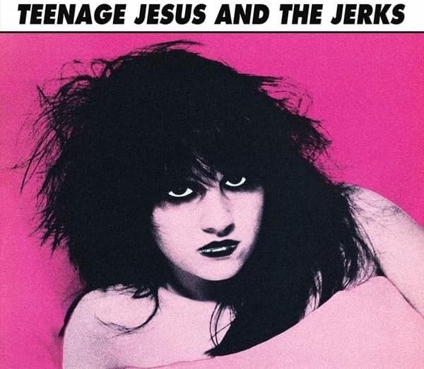 Pink album cover featuring a black and white portrait of a person with dark hair.