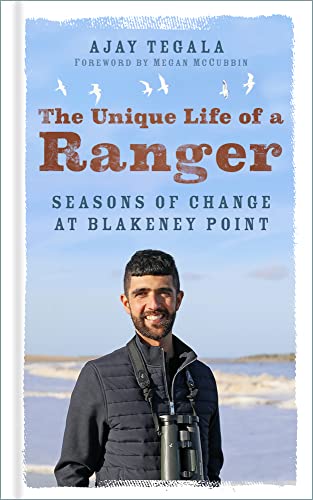 Book cover featuring a smiling man with binoculars, coastal background.