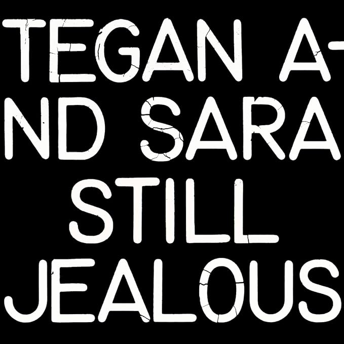 Black background with white text reading "Tegan & Sara - Still Jealous".