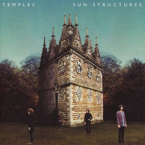 CD cover: ornate brick tower with four figures in front.