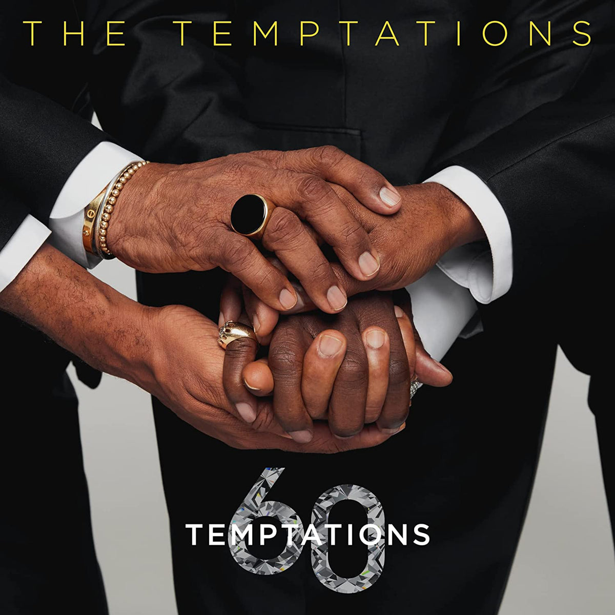 CD cover for The Temptations’ “Temptations 60” featuring clasped hands.