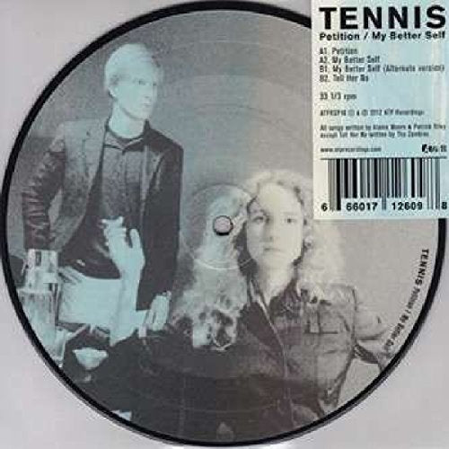 Vinyl record with black and white image of two people and a dog.