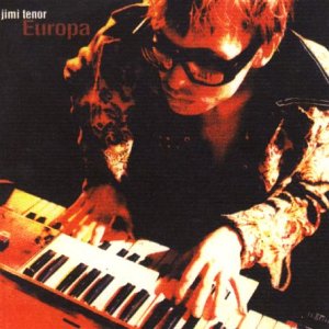 Jimi Tenor album cover: musician at a keyboard, orange tones.