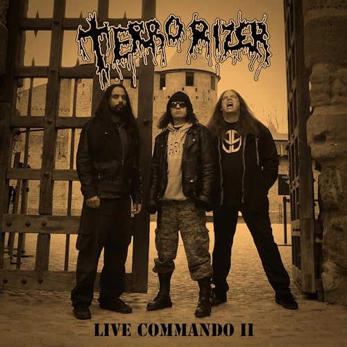Terrorizer band members posing in front of a medieval castle tower.