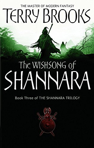 Book cover showing a hooded figure in a green forest with a red emblem below.