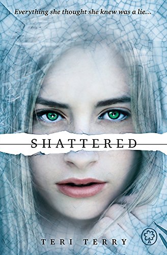 Book cover featuring a girl with striking green eyes behind a shattered glass effect.
