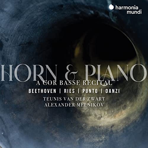 CD cover featuring a dark, blurred image of a French horn bell.