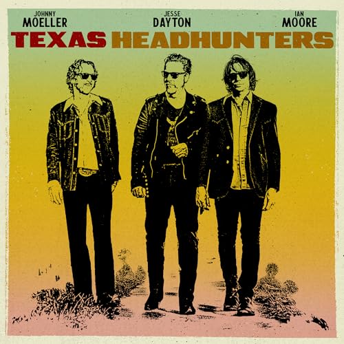 Three men in sunglasses stand on a desert path against a gradient background.