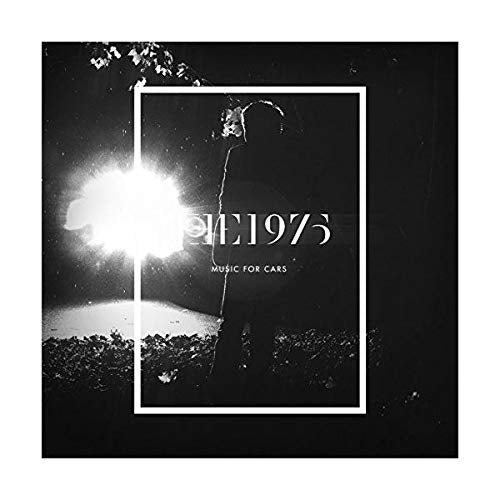 Black and white album cover showing a silhouette against a bright light with text.