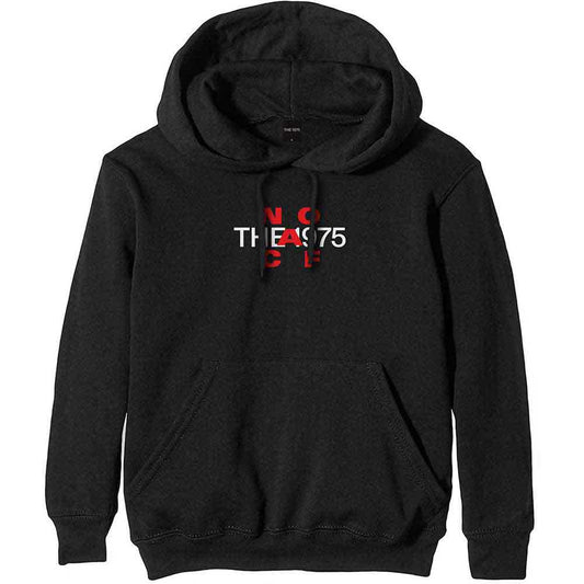 A man wearing a black pullover hoodie with yellow NOACF The 1975 text.