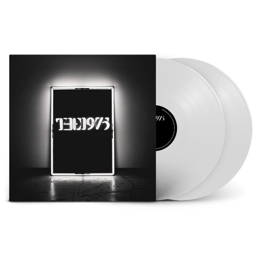 The 1975 album cover with two white vinyl records standing beside it.