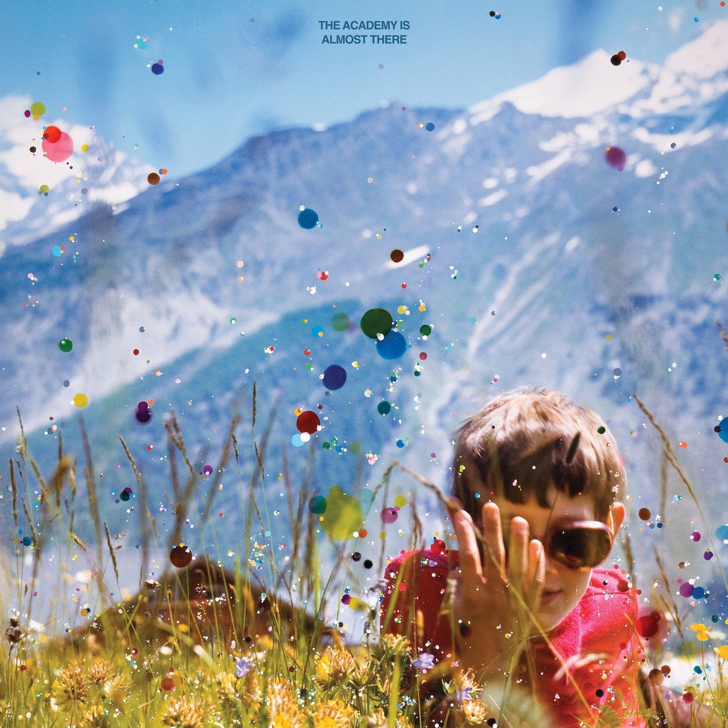 Album cover: boy in field with colorful bubbles, mountains backdrop.