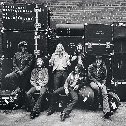 "Black and white vinyl record cover with The Allman Brothers Band posing."