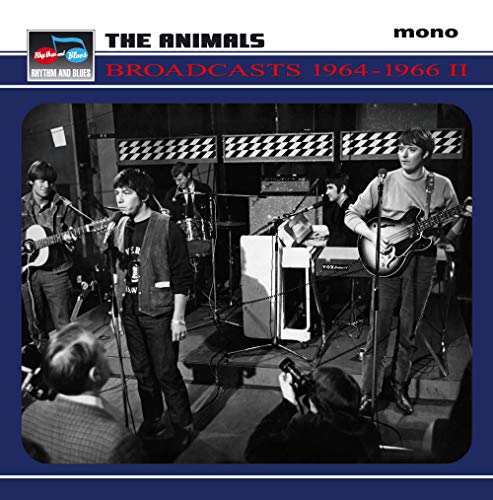 Black and white photo of The Animals band performing on stage.