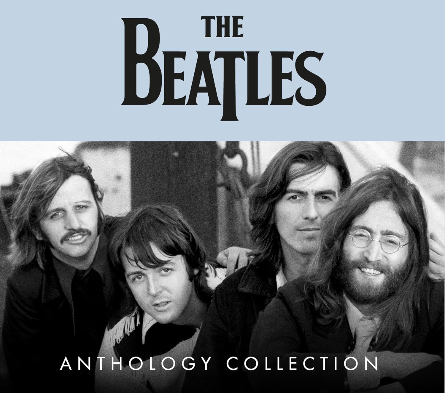 Black and white photo of The Beatles with the band name and Anthology Collection text.