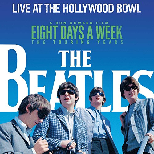 The Beatles album cover featuring the four band members against a blue background.