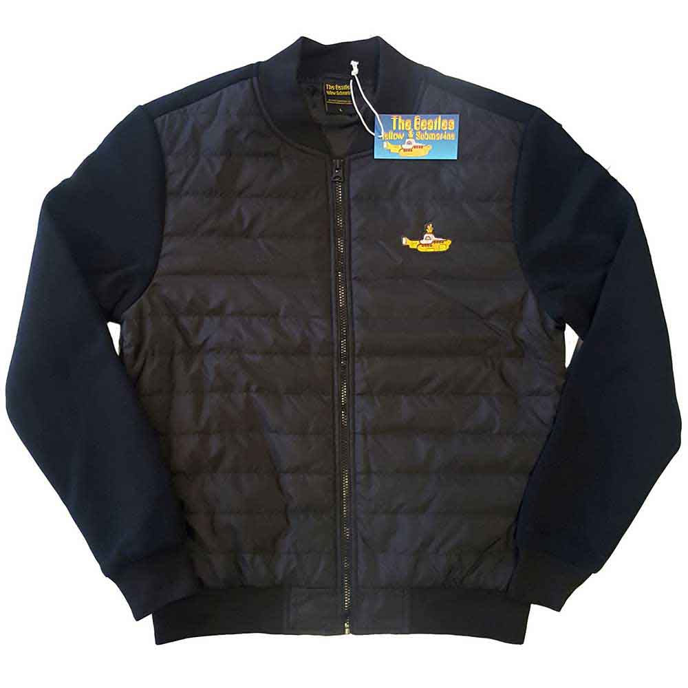 Man wearing a black quilted jacket with a Yellow Submarine patch.